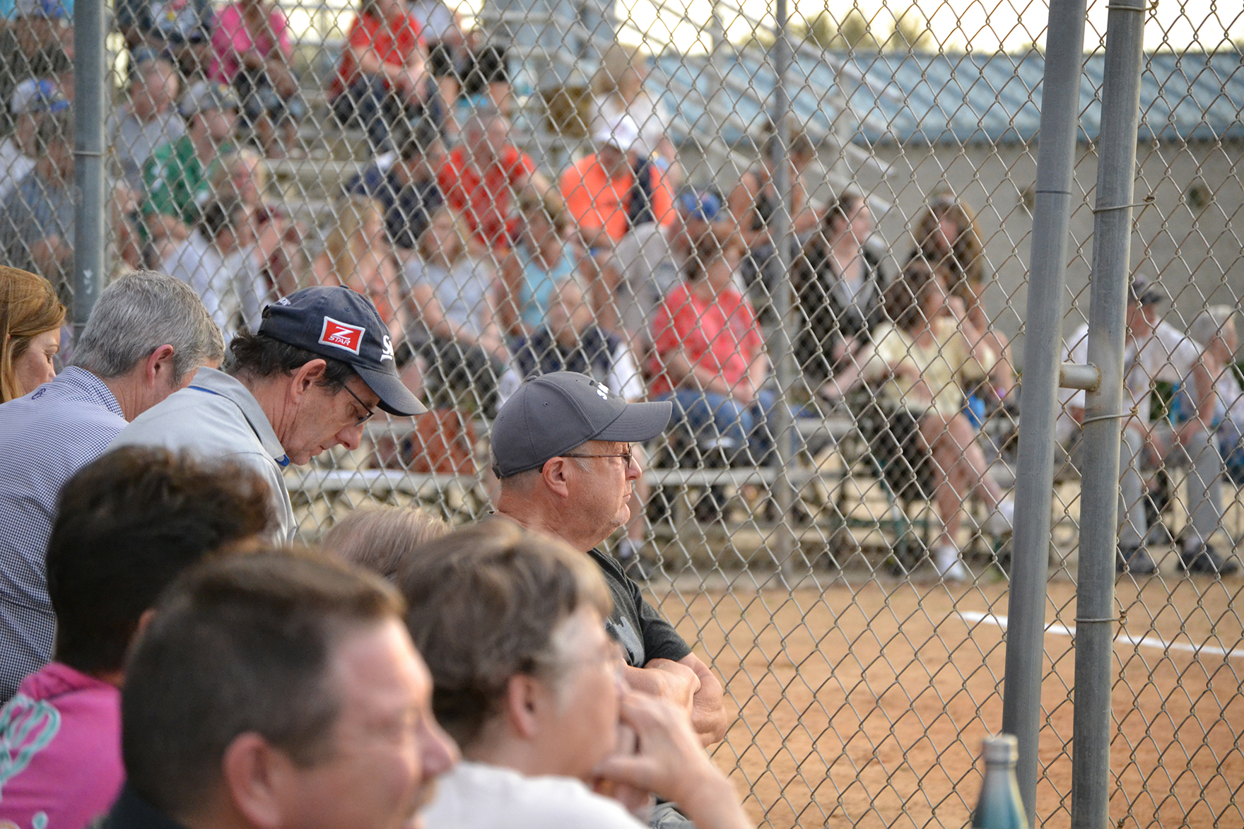 The crowd watches the game during a senior softball event