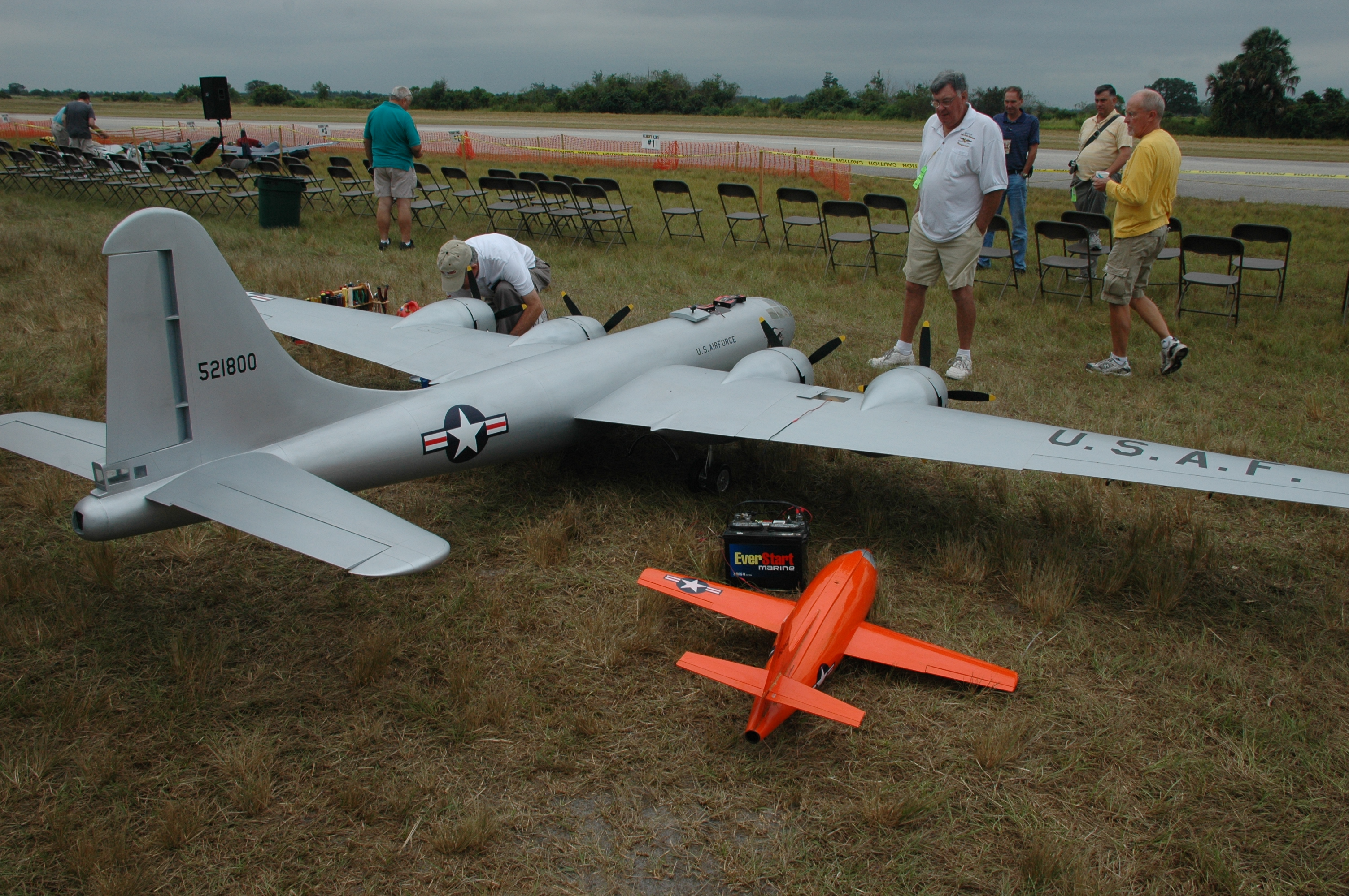 Admirers look at the large radio controlled planes on display at the Top Gun event