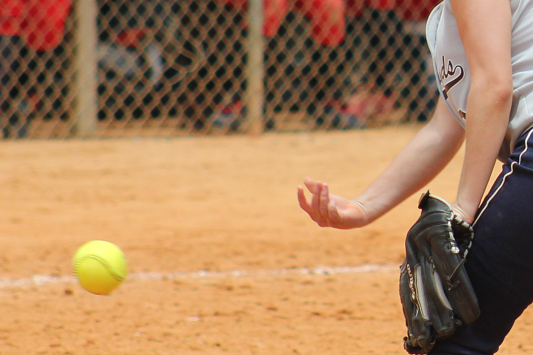 A softball is pitched